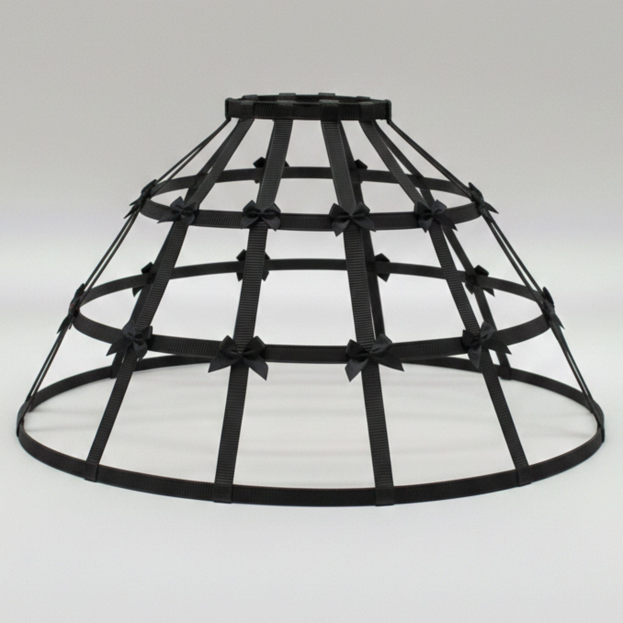 Black Crinoline hoop cage skirt with black bows on a white background
