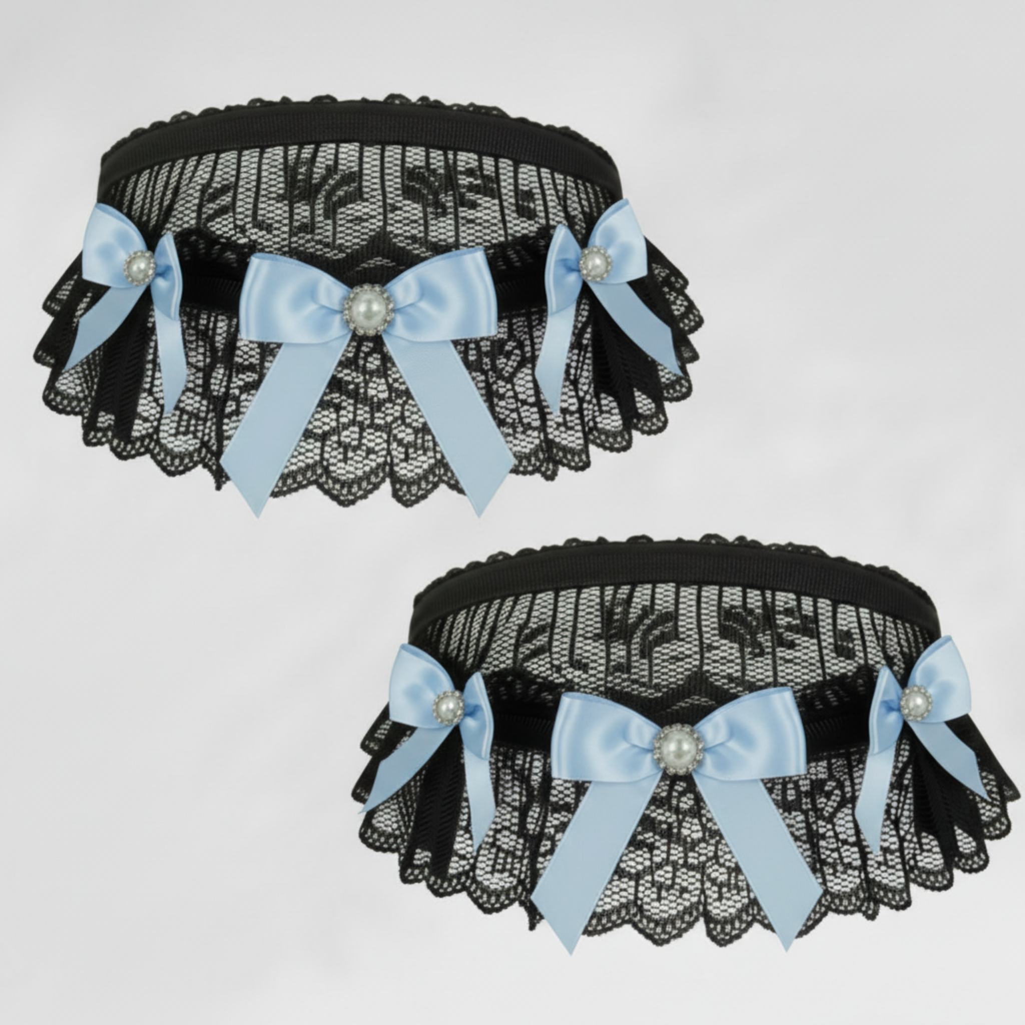 Black lace choker & garter with Blue satin bows and decorative elements on a light gray background