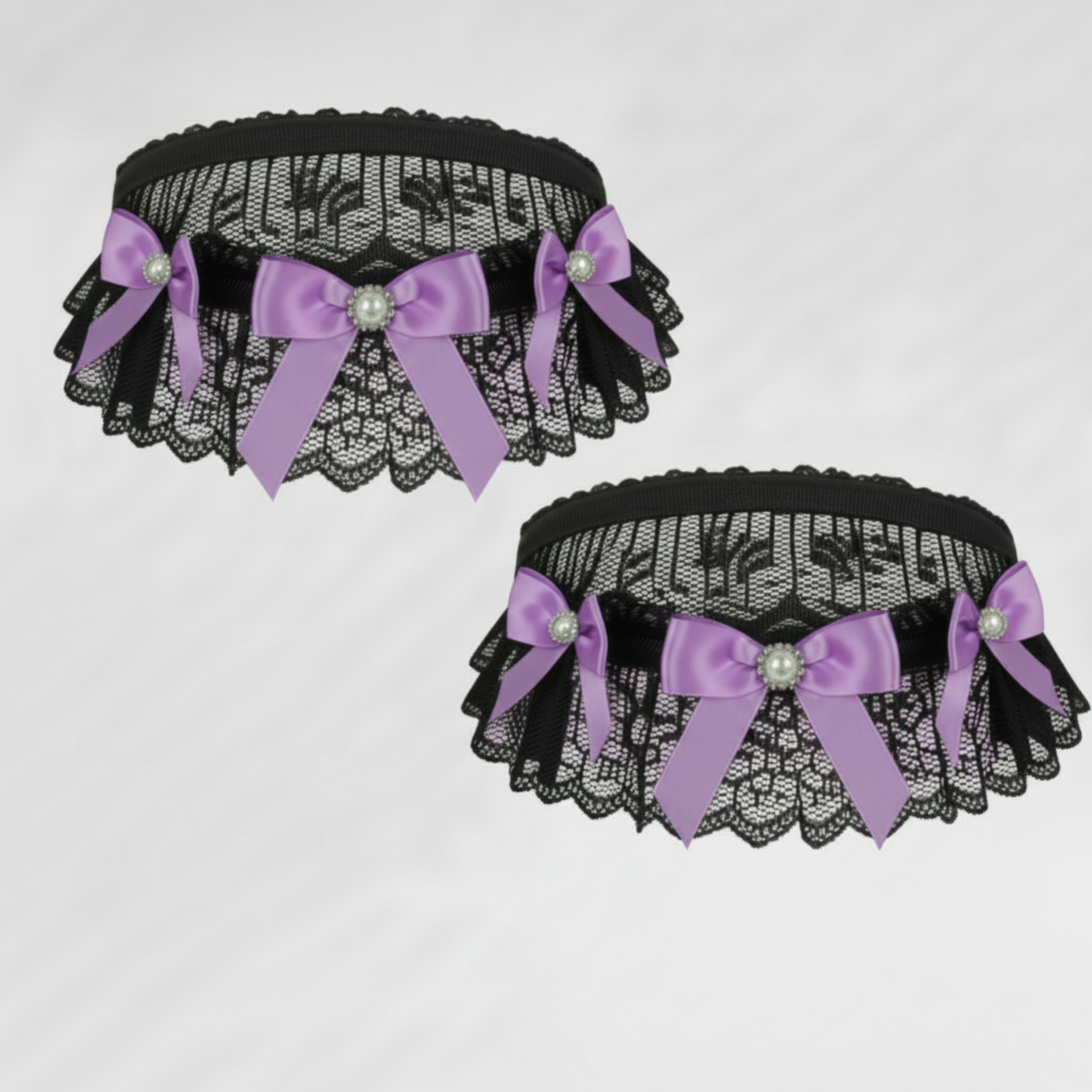 Black lace choker & garter with lavender satin bows and decorative elements on a light gray background