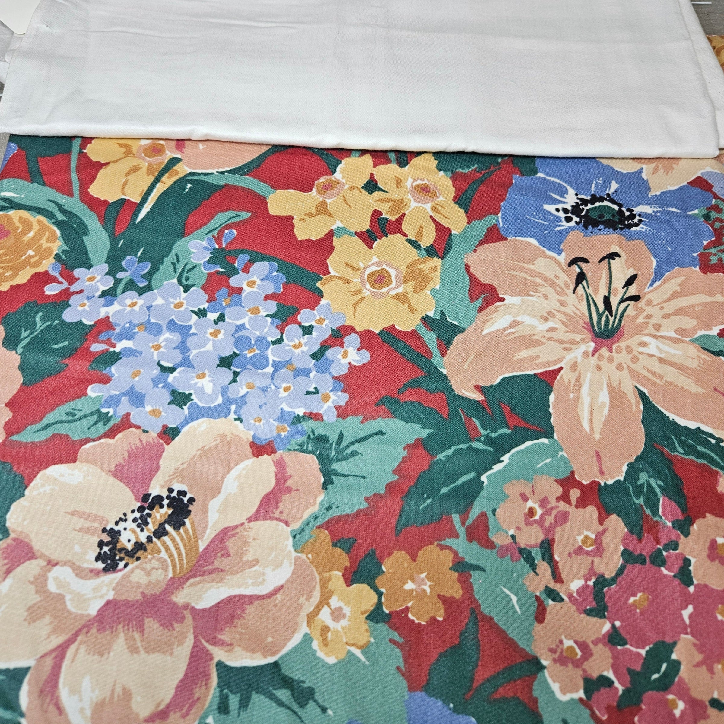 Floral fabric with a colorful pattern on a red background