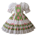 A green and pink floral Lolita-style dress displayed on a dress form mannequin against a plain white background.
