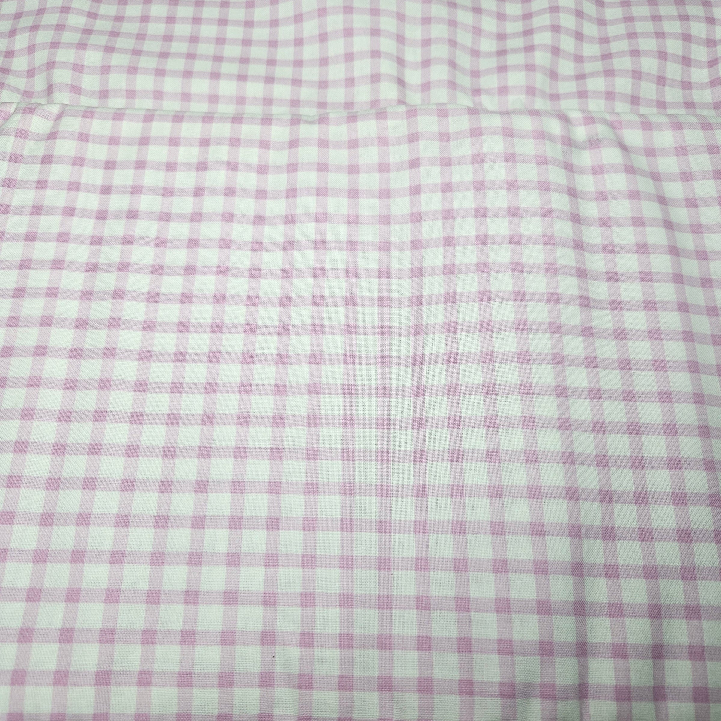 Checkered fabric with pink and white pattern