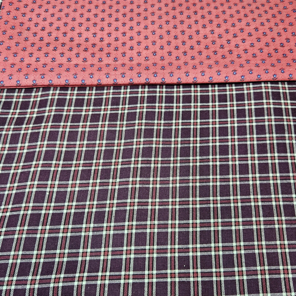 Two different fabric patterns side by side on a pink background