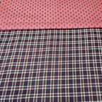 Two different fabric patterns side by side on a pink background