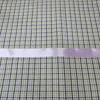 Green and purple checkered fabric with a lavender ribbon on top