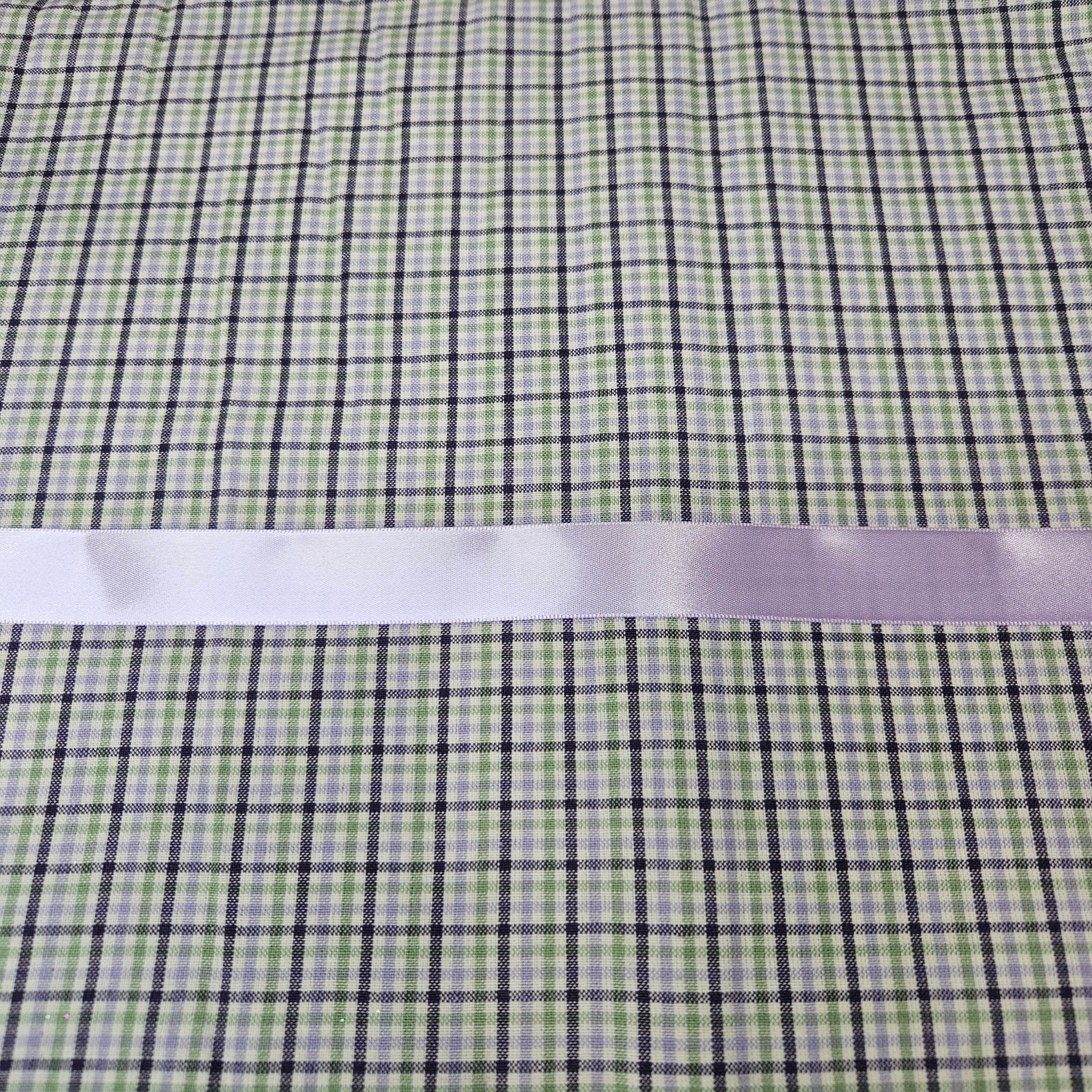 Green and purple checkered fabric with a lavender ribbon on top