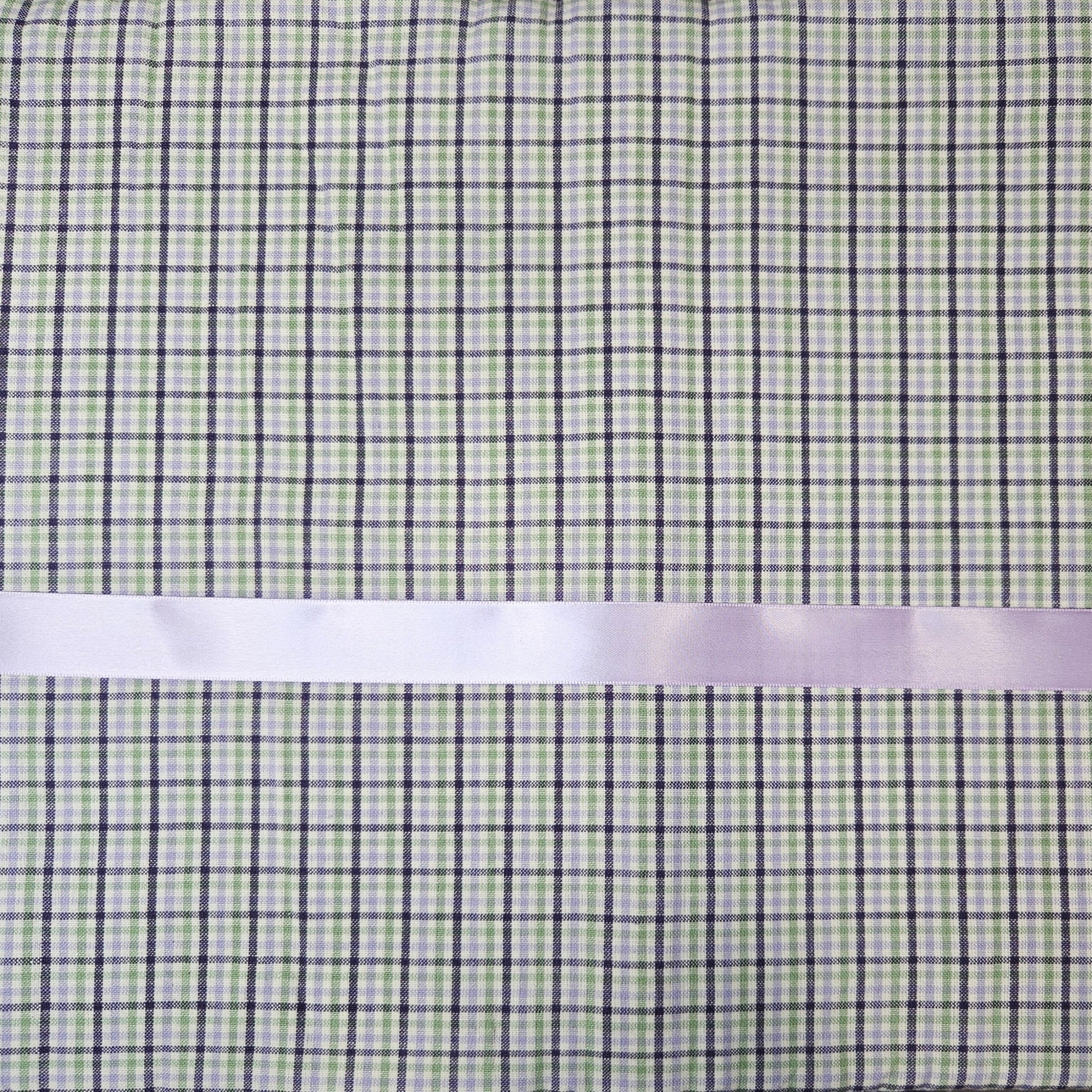 Checkered fabric with a lavender ribbon on a green and lavender checkered background