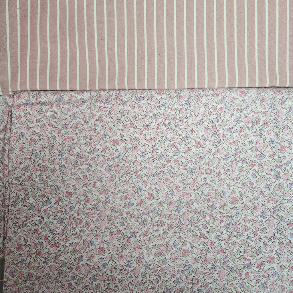 Two fabric swatches, one with a striped pattern and the other with a floral pattern.