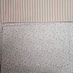 Two fabric swatches, one with a striped pattern and the other with a floral pattern.