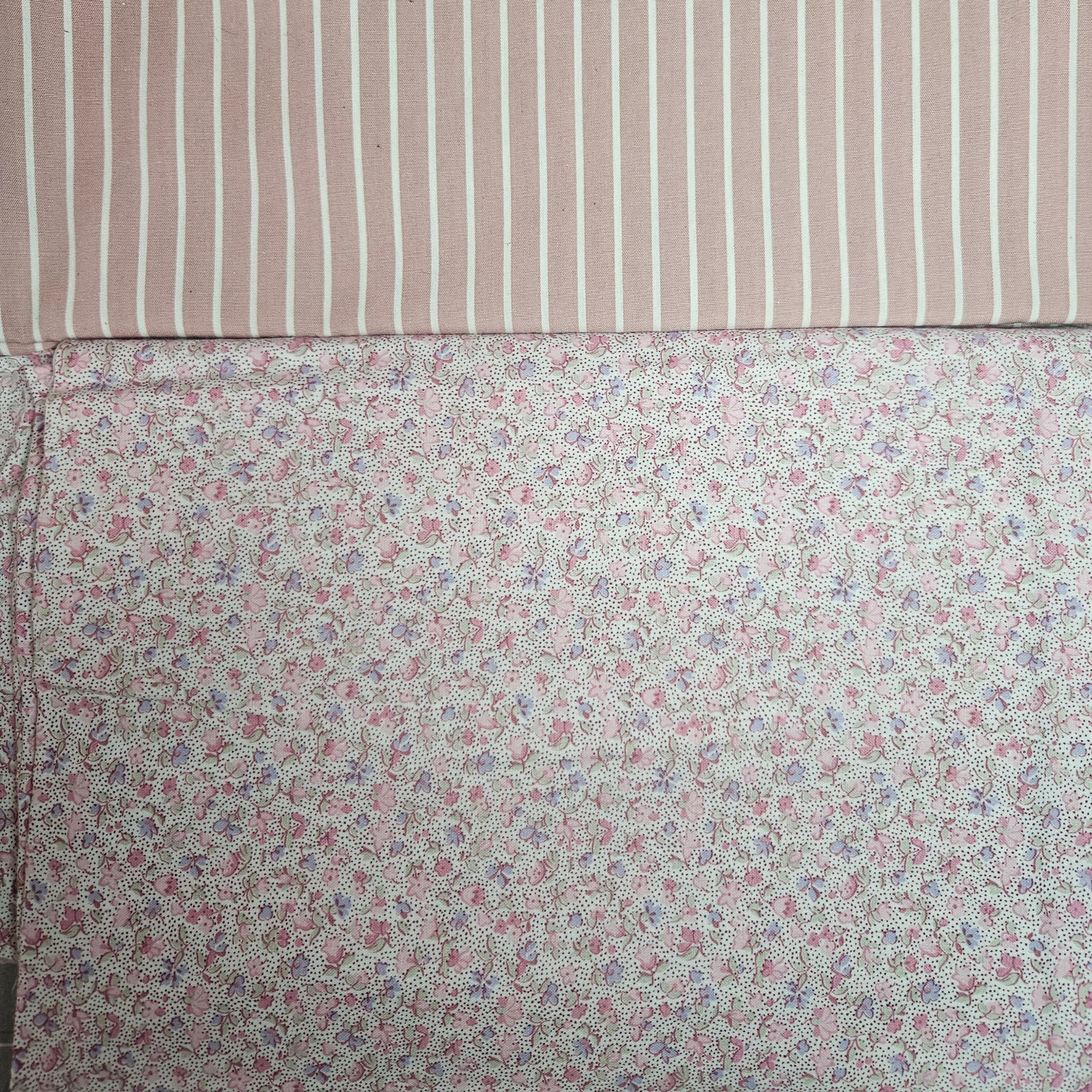 Two fabric swatches, one with a striped pattern and the other with a floral pattern.