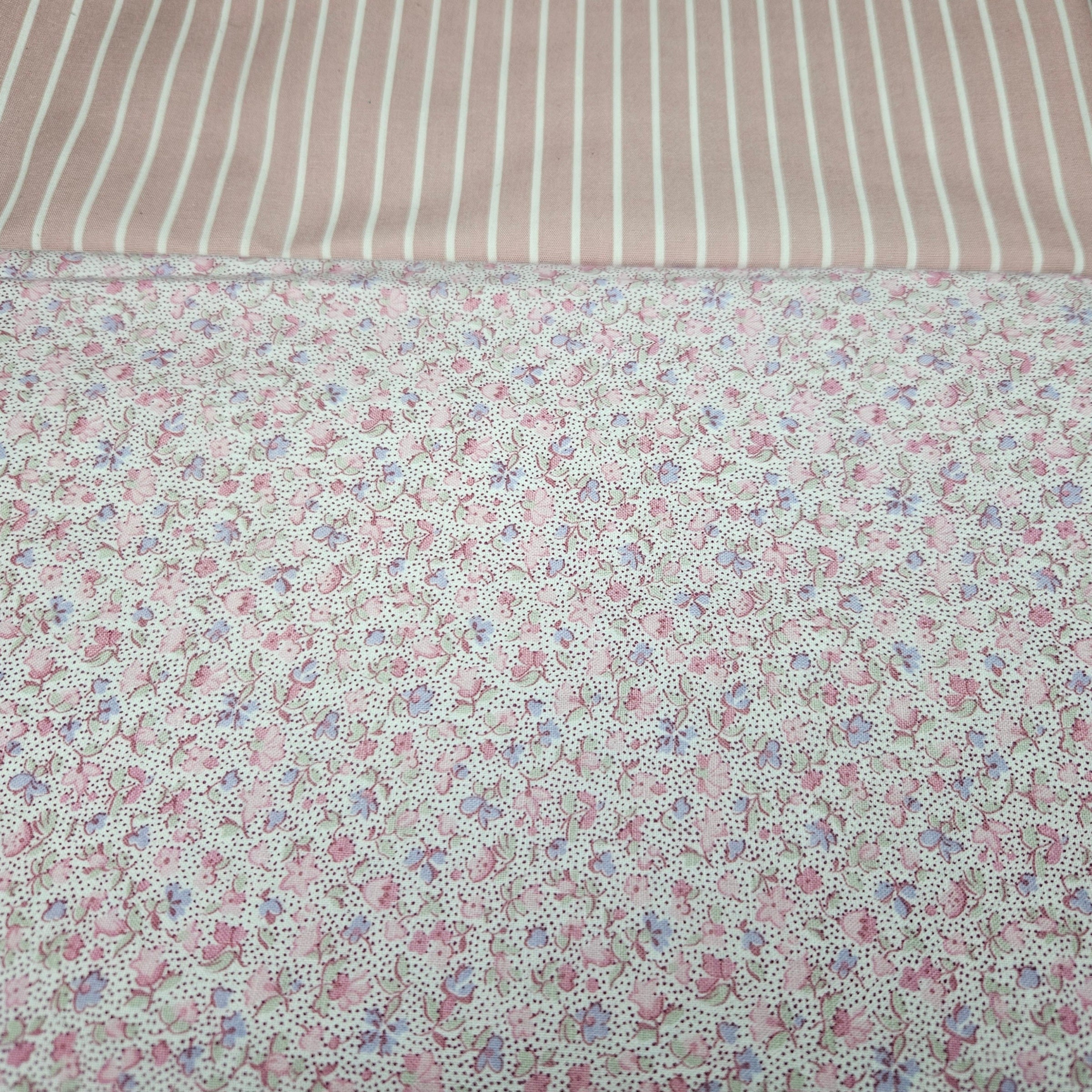 Floral fabric with a striped fabric in the background