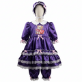 A purple satin sissy dress with matching bloomers and bonnet