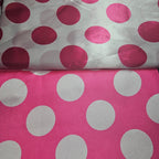 Two fabric swatches with hot pink and white satin polka dot patterns