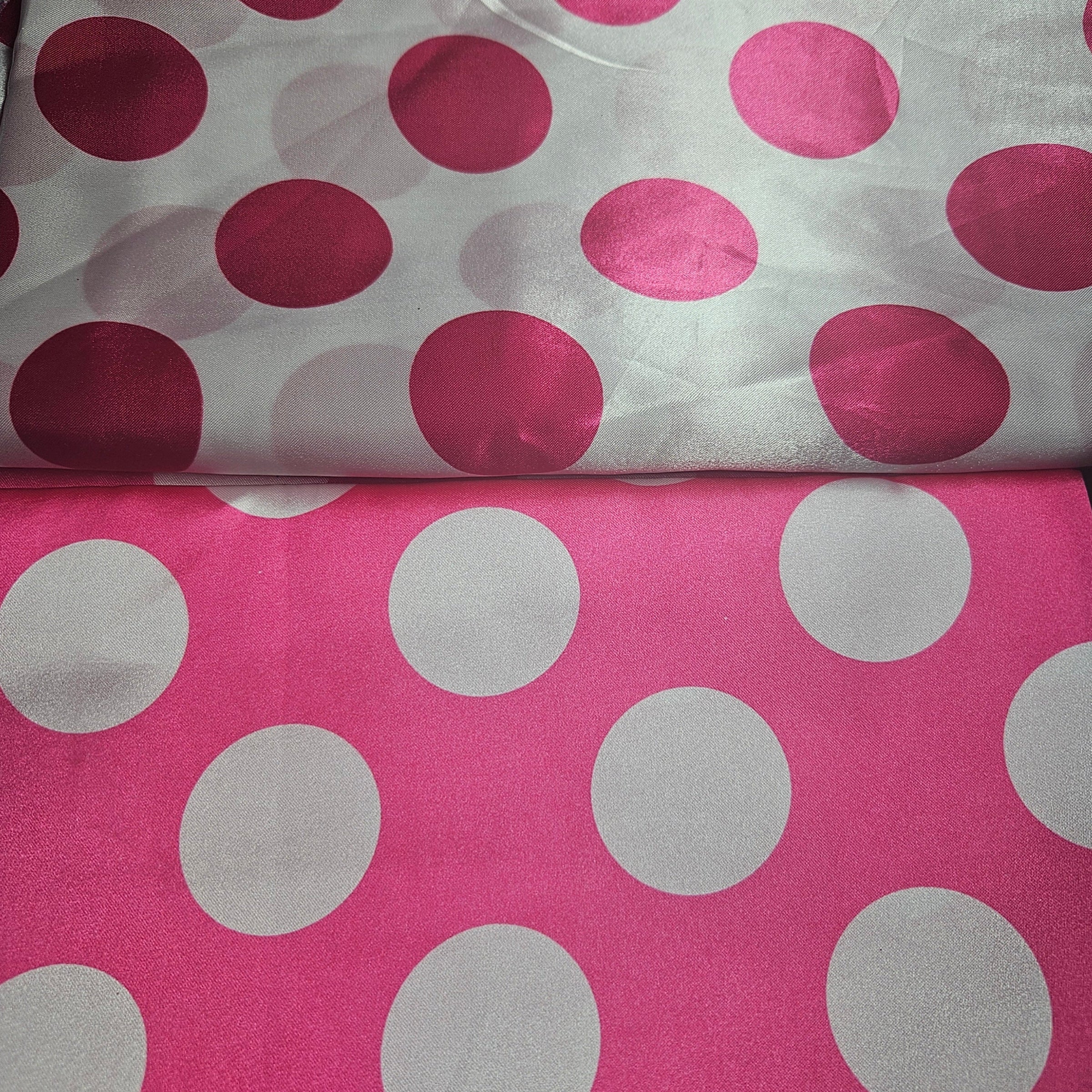 Two fabric swatches with hot pink and white satin polka dot patterns