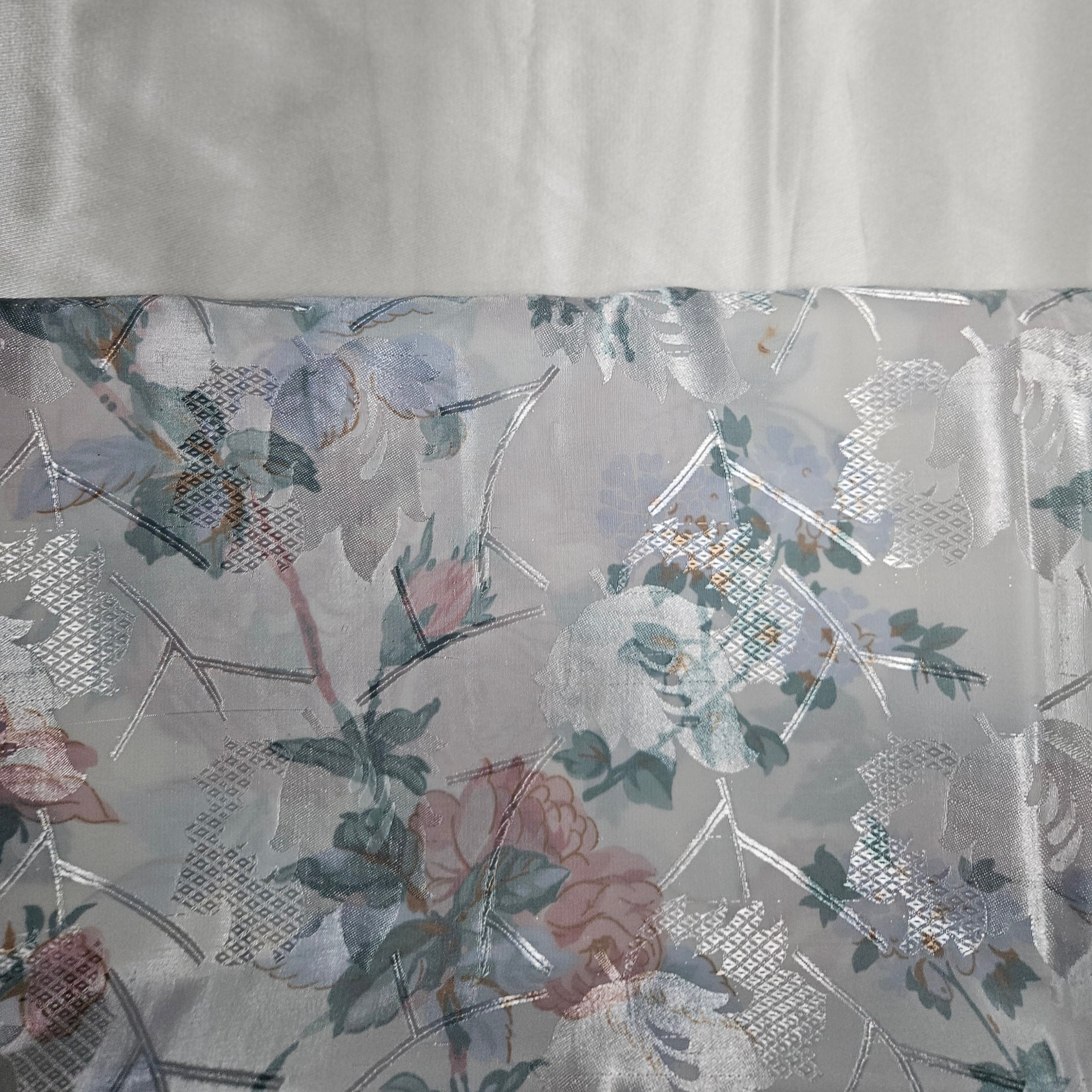 Floral patterned fabric with a ivory background