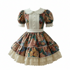 A Lolita-style short dress features a colorful floral print with a Peter Pan collar, front panel,  ruffled cuffs, and layered cream lace ruffles at the hem.