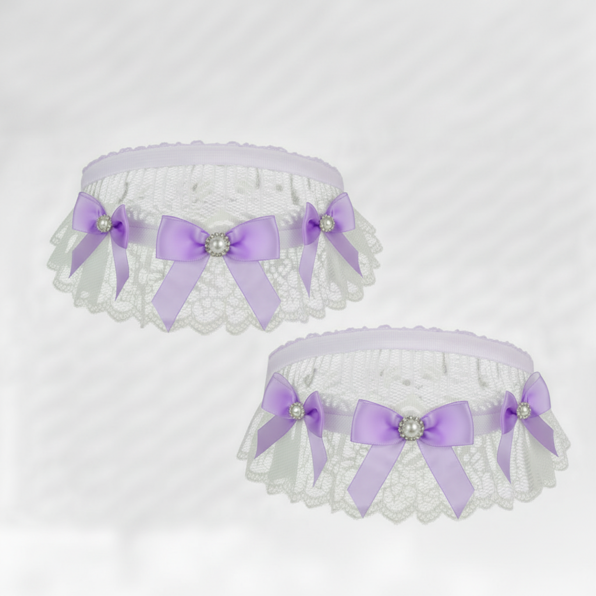 White lace garters  with purple bows on a white background
