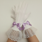 White lace gloves with purple ribbon bows on a neutral background
