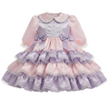 A pink and lavender satin sissy dress with lace trim on a white background