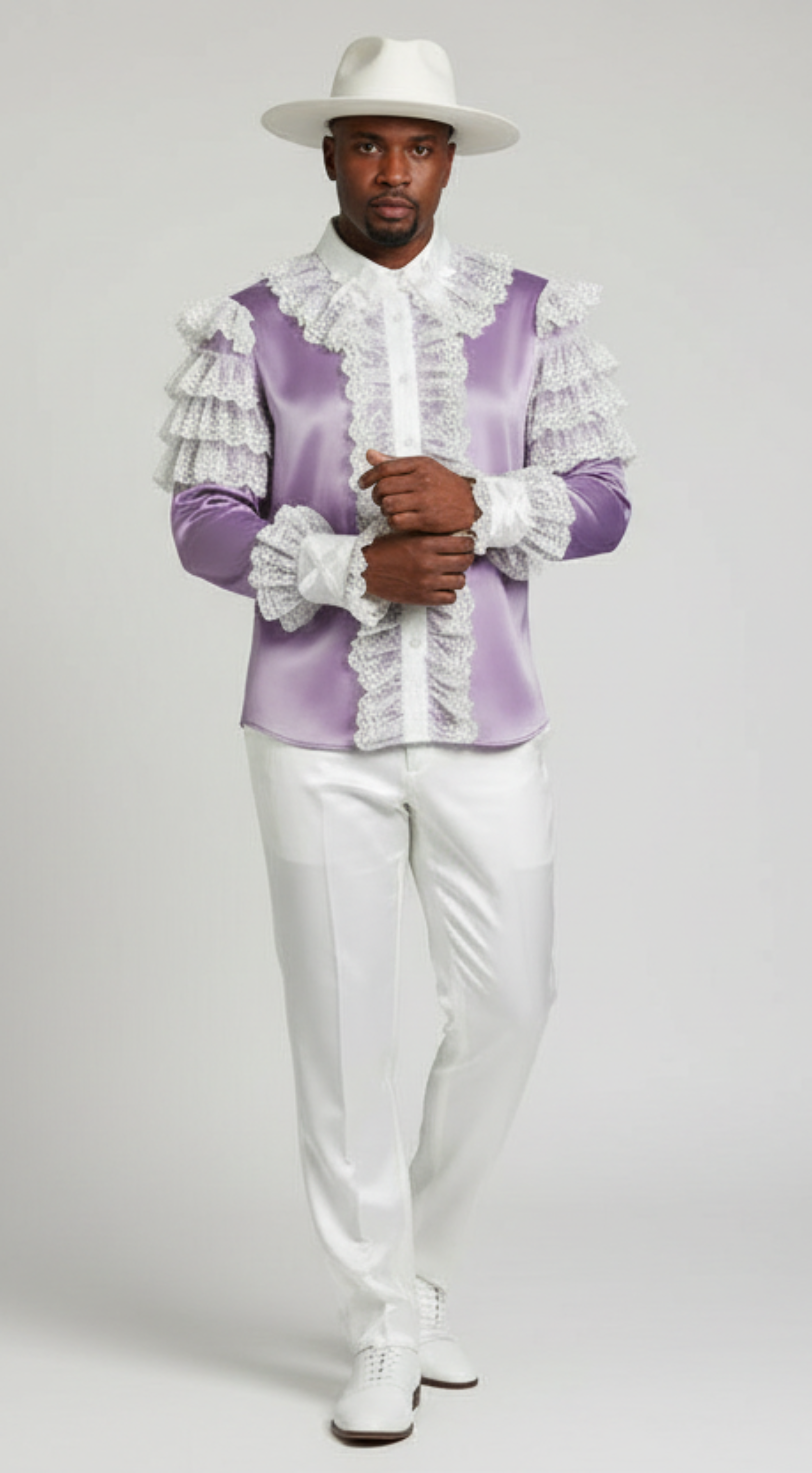 Man wearing a purple and white outfit with ruffled details on a gray background