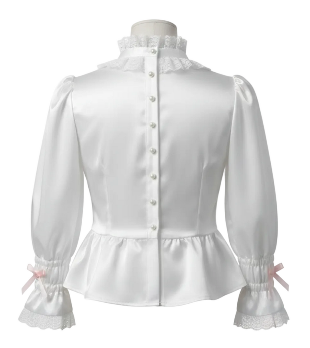 White satin blouse with pearl buttons on a white background