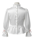 White satin blouse with pearl buttons on a white background