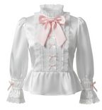 White satin blouse with pink bows on a white background