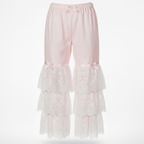 Pink lace pajama pants on a white background