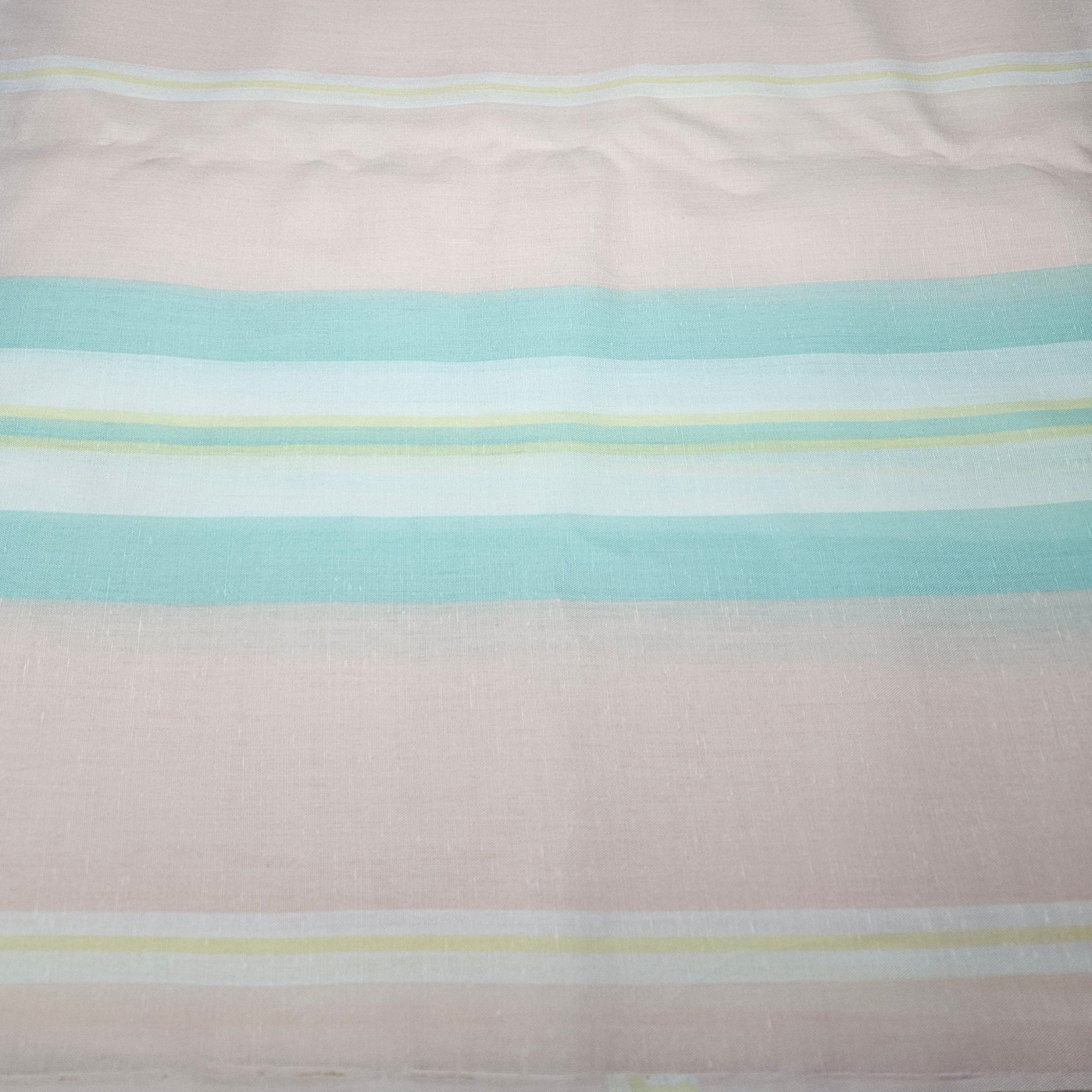 Striped fabric with pastel colors on a peach background