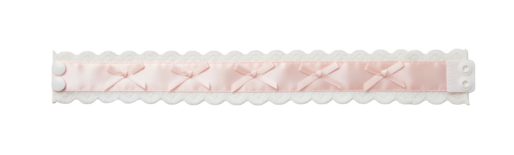 Pink satin choker with decorative elements on a white background