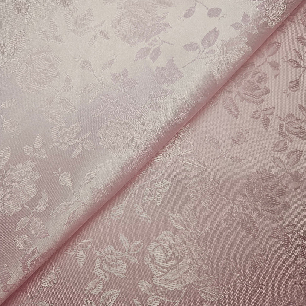 Pink brocade fabric with floral pattern