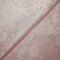 Pink brocade fabric with floral pattern