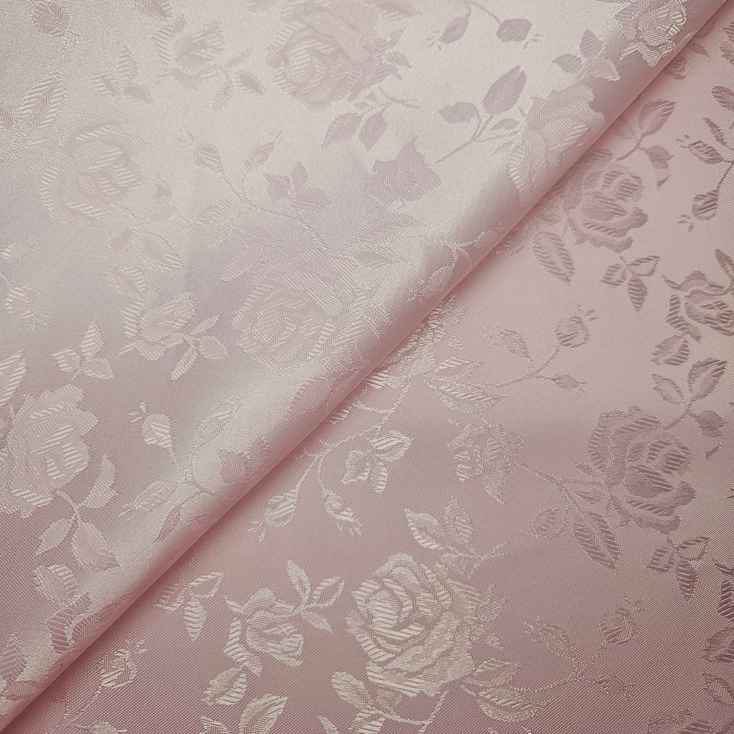 Pink brocade fabric with floral pattern