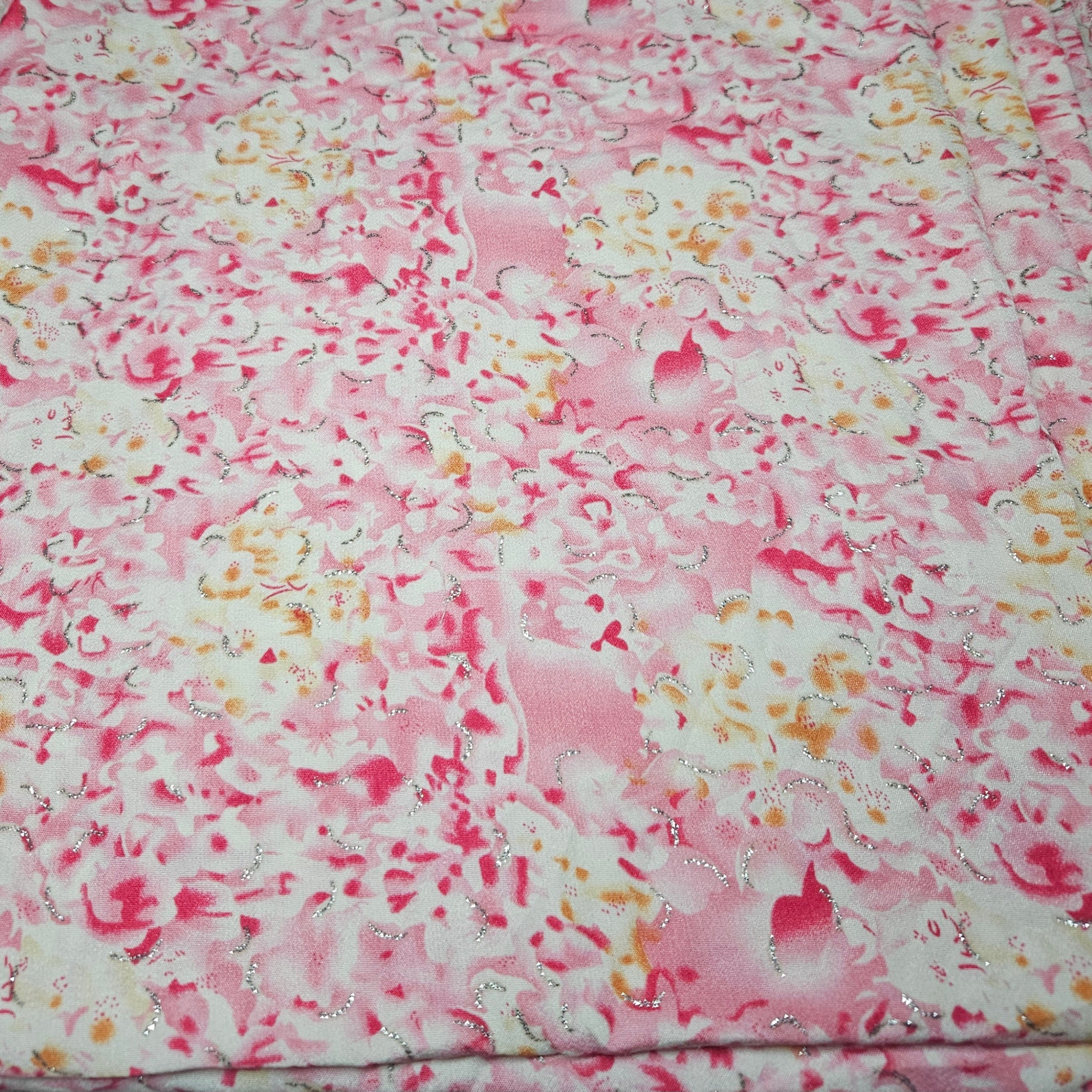 Floral fabric with pink and white flowers on a pink background