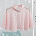 Pink lace cape with embellishments on a white background