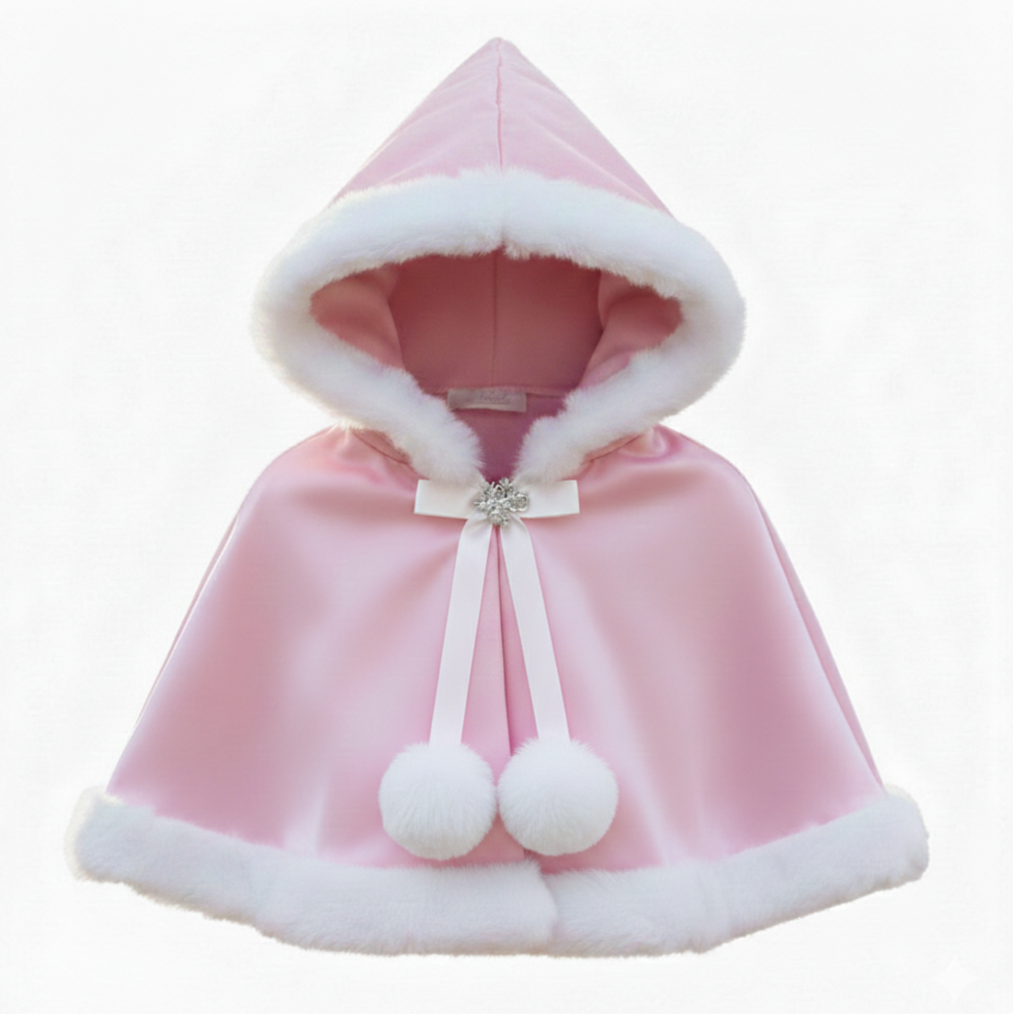 Pink hooded cloak with white fur trim and pom-poms on a white background