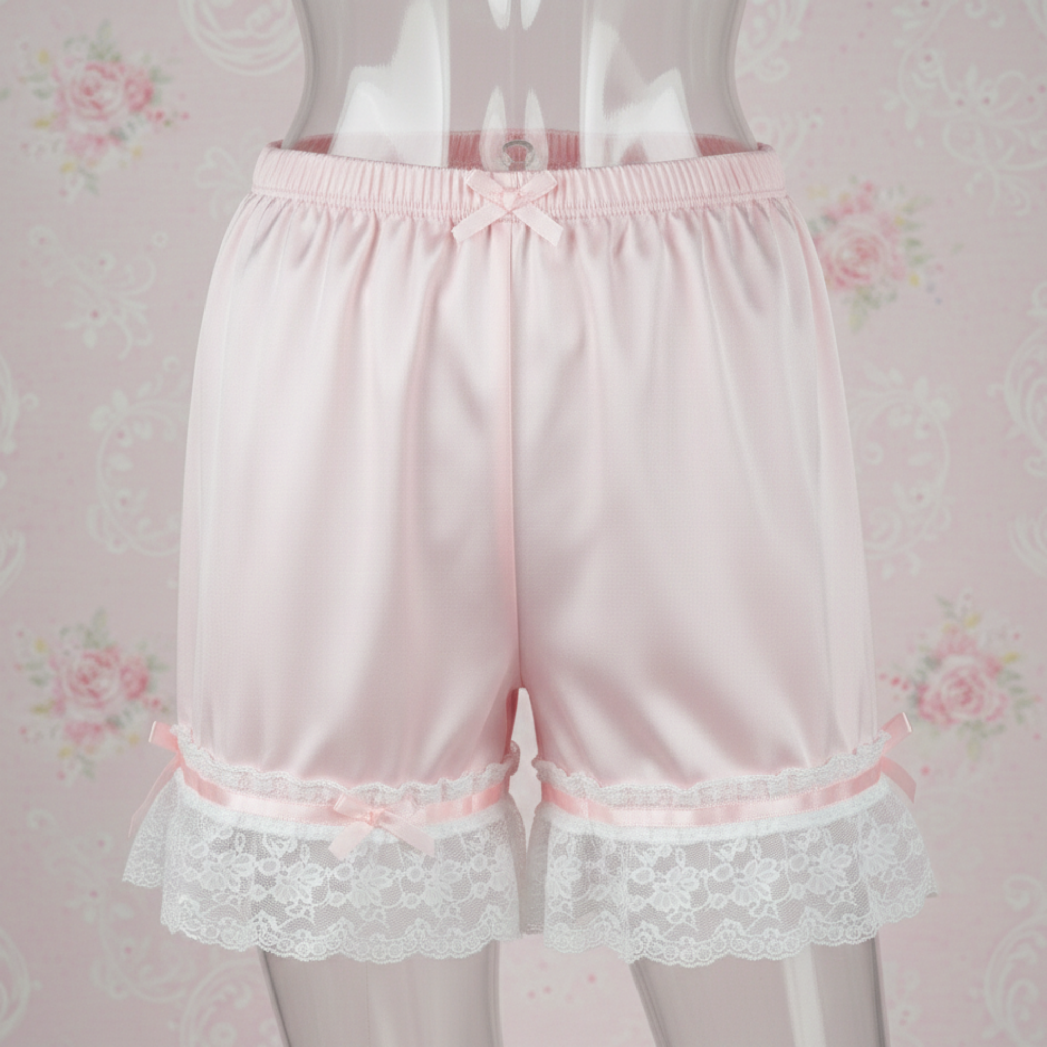 Pink Satin Sleep Shorts with lace trim on a floral background
