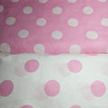 Two fabric swatches with polka dot patterns on a pink and white background.