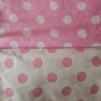 Two fabric swatches with polka dot patterns on a pink and white background.