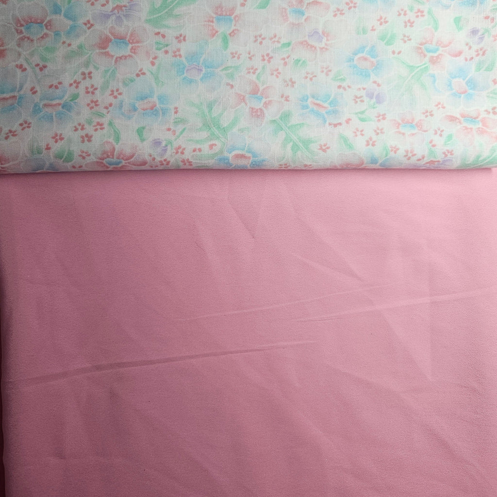 Floral fabric with a pink background
