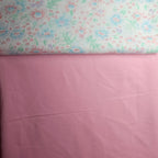 Floral fabric with a pink background