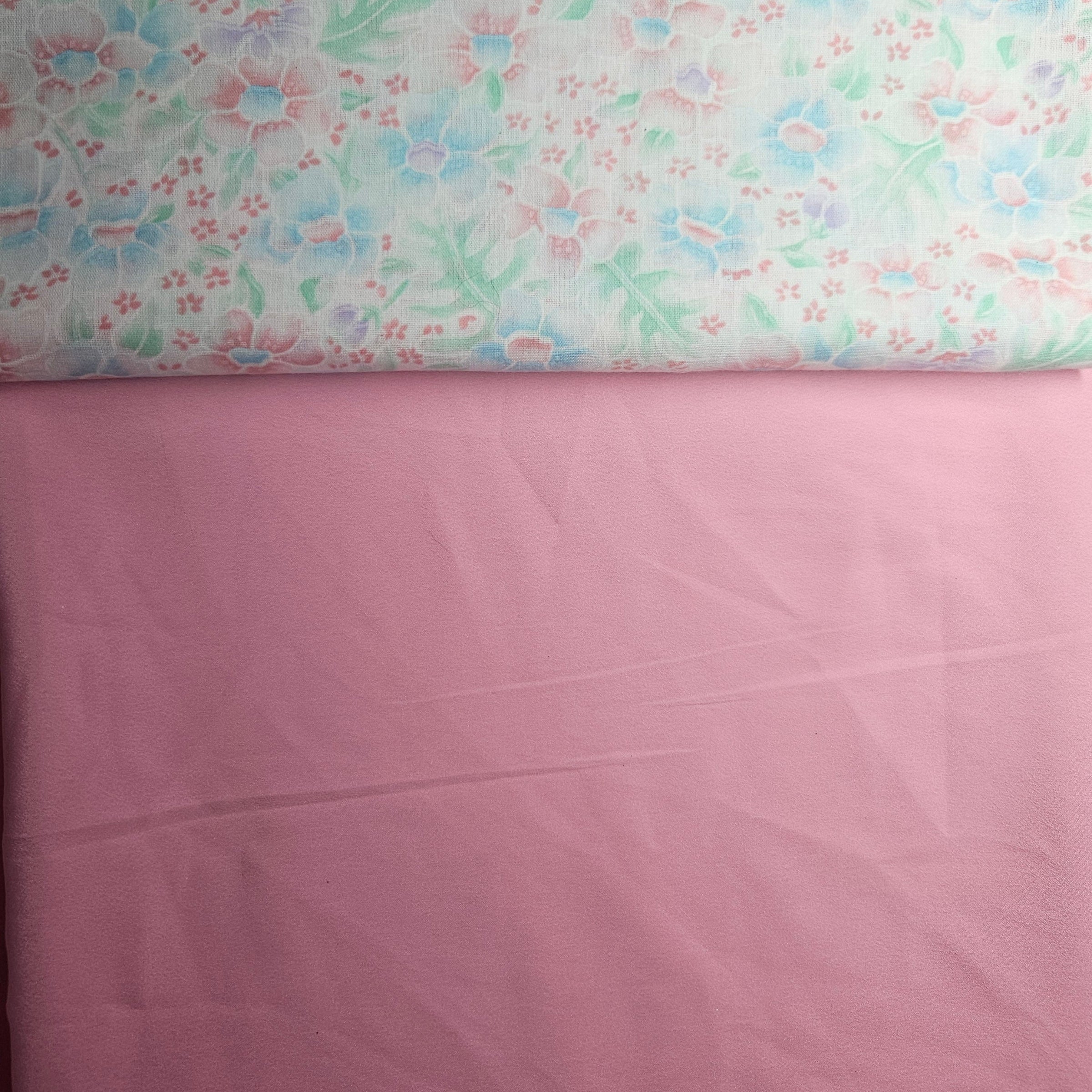 Floral fabric with a pink background