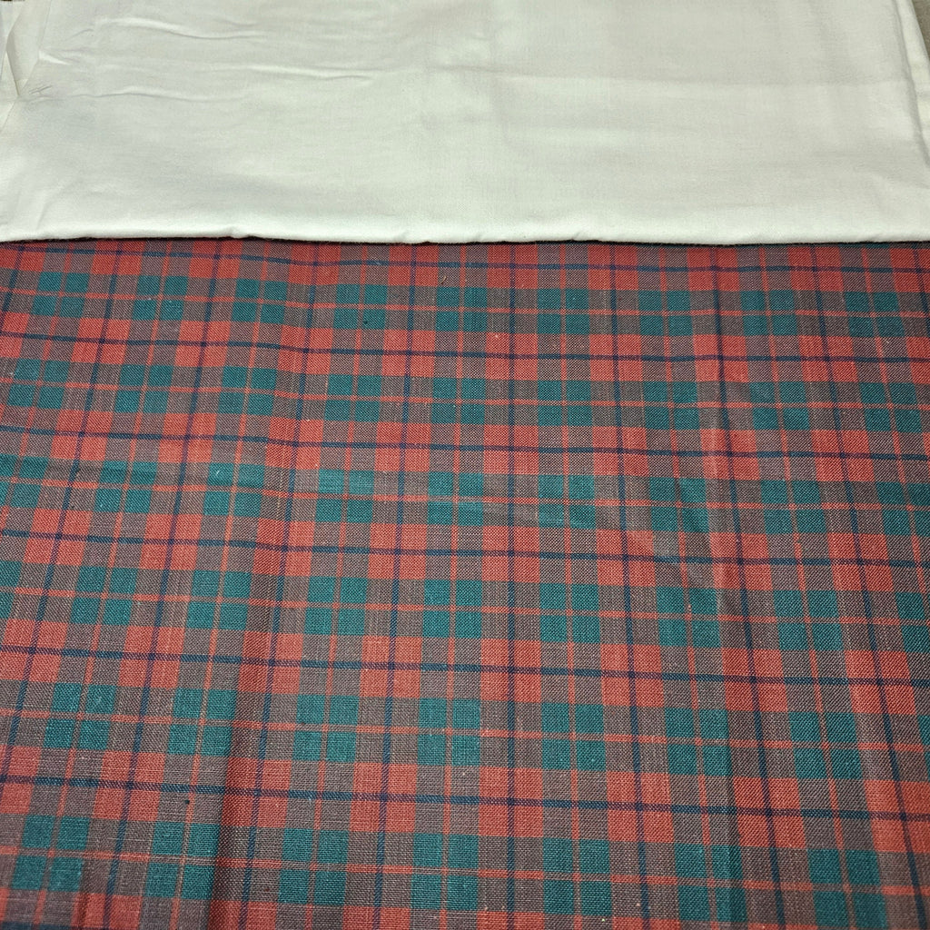 Plaid fabric with red and blue pattern on a white background