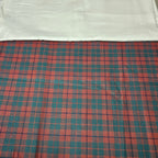Plaid fabric with red and blue pattern on a white background