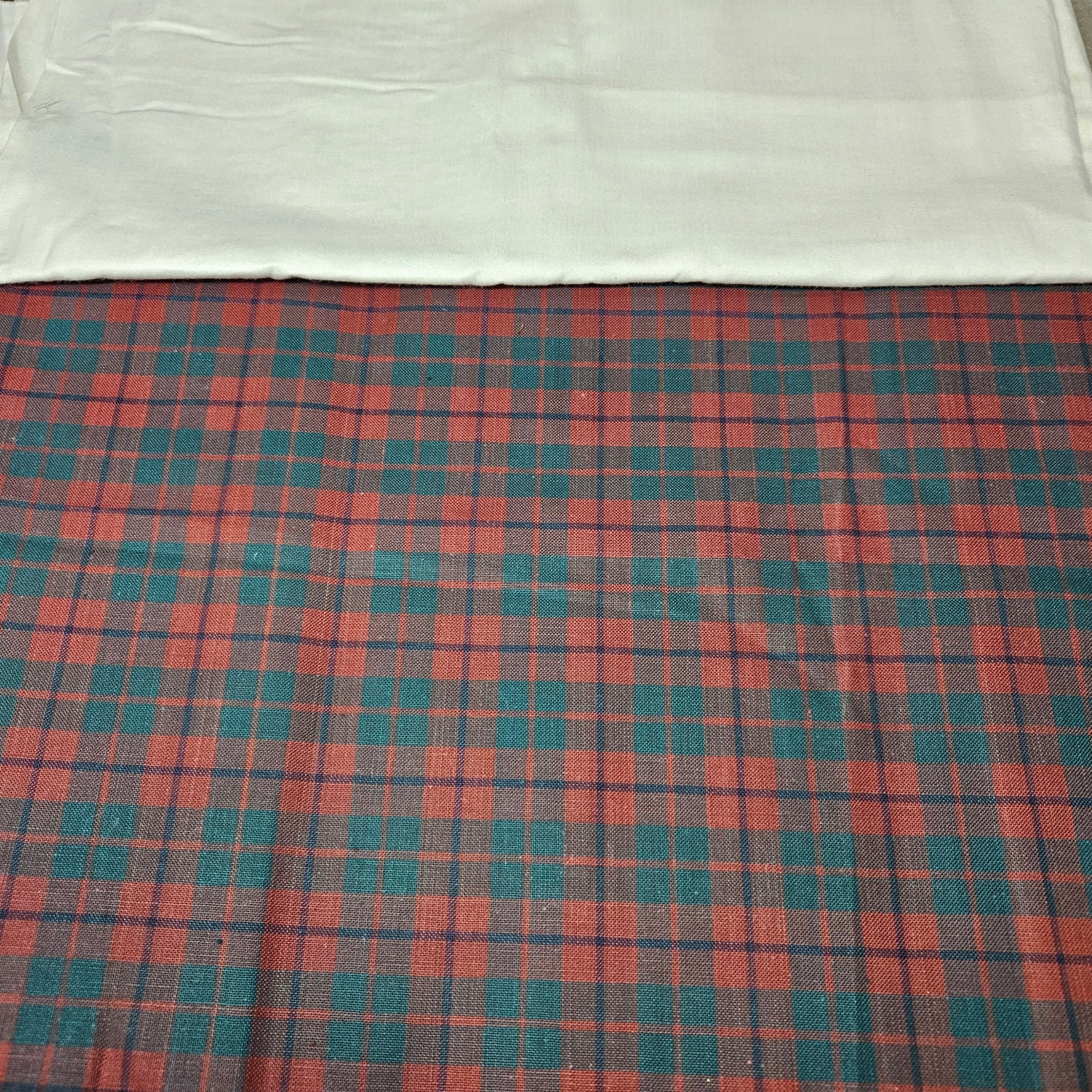 Plaid fabric with red and blue pattern on a white background