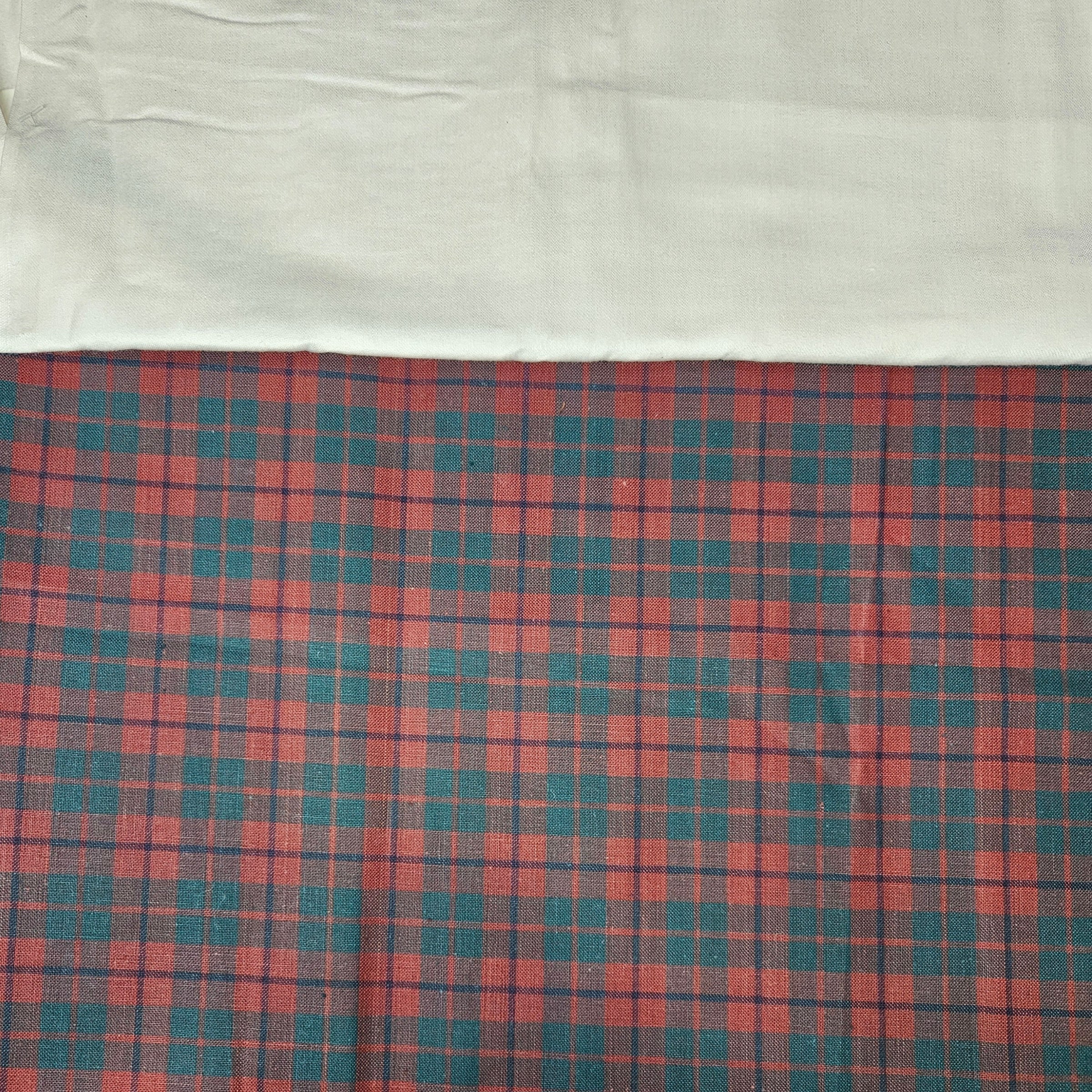 Plaid fabric with red and blue pattern on a white background