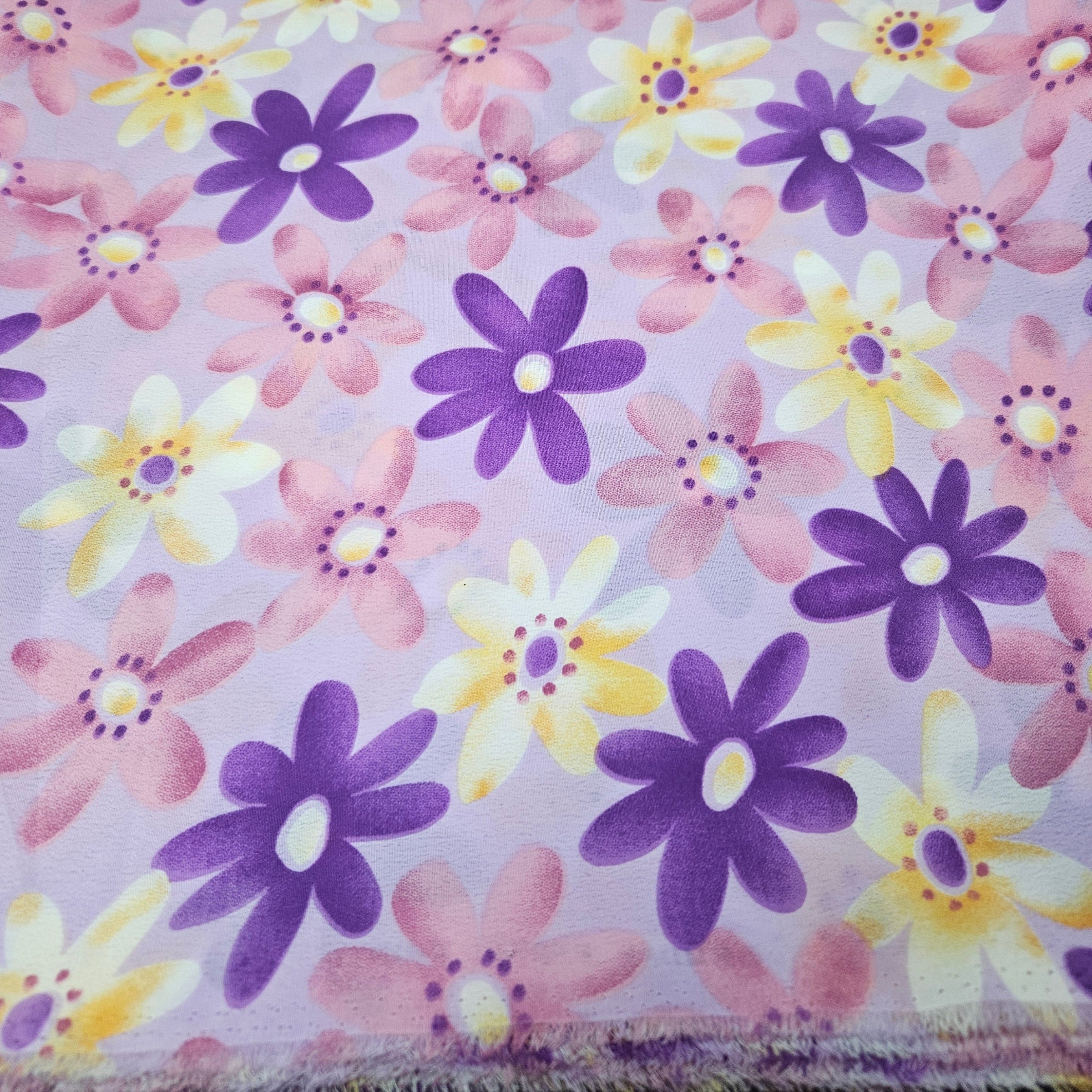Floral pattern with purple, yellow, and pink flowers on a light purple background
