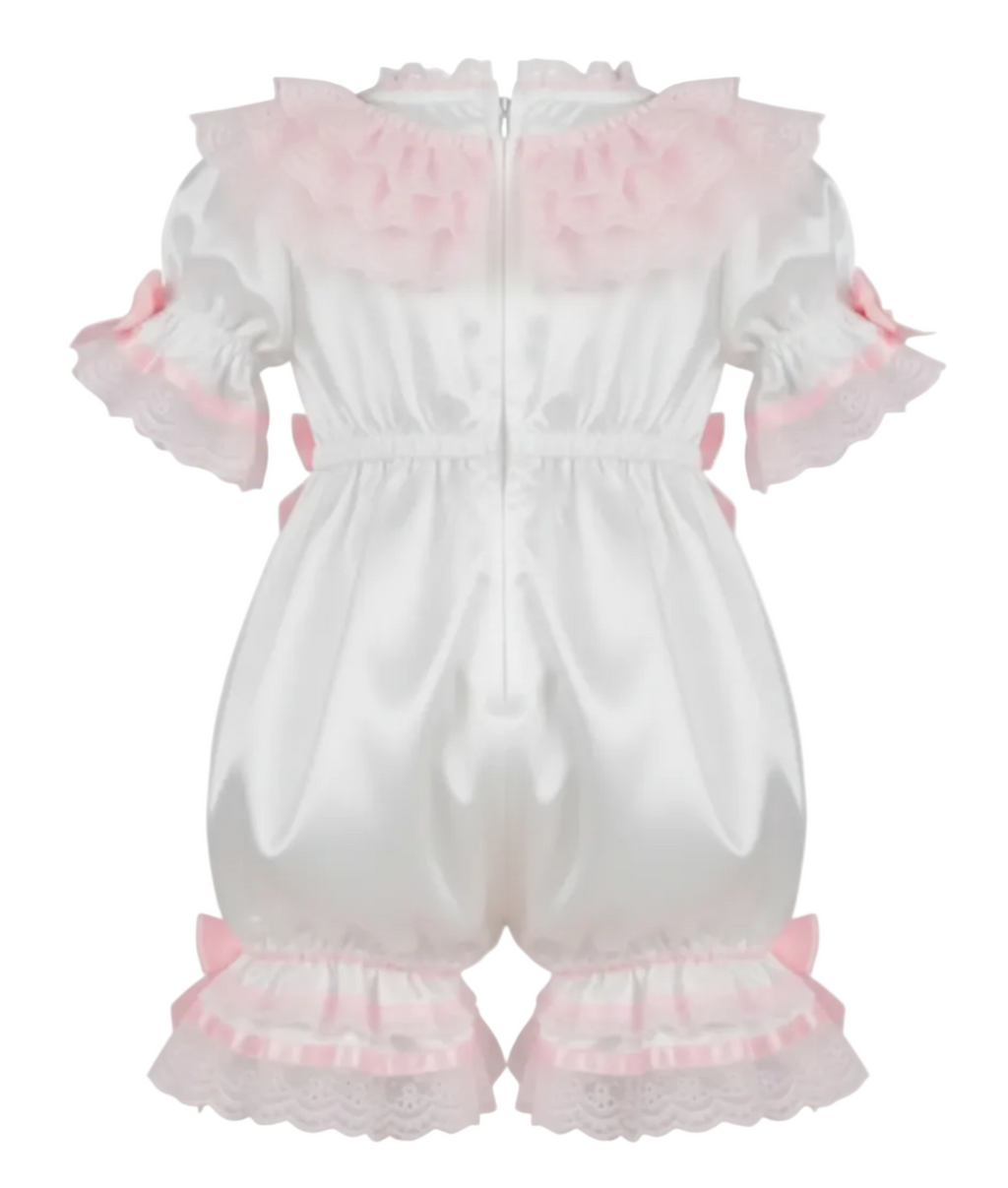 White baby outfit with pink ruffles on on a white background