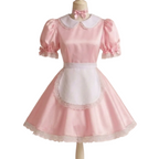 A pink and white maid outfit displayed on a mannequin, featuring a pink satin dress with puff sleeves, a white collar, a matching pink bow, and a white apron with lace trim.