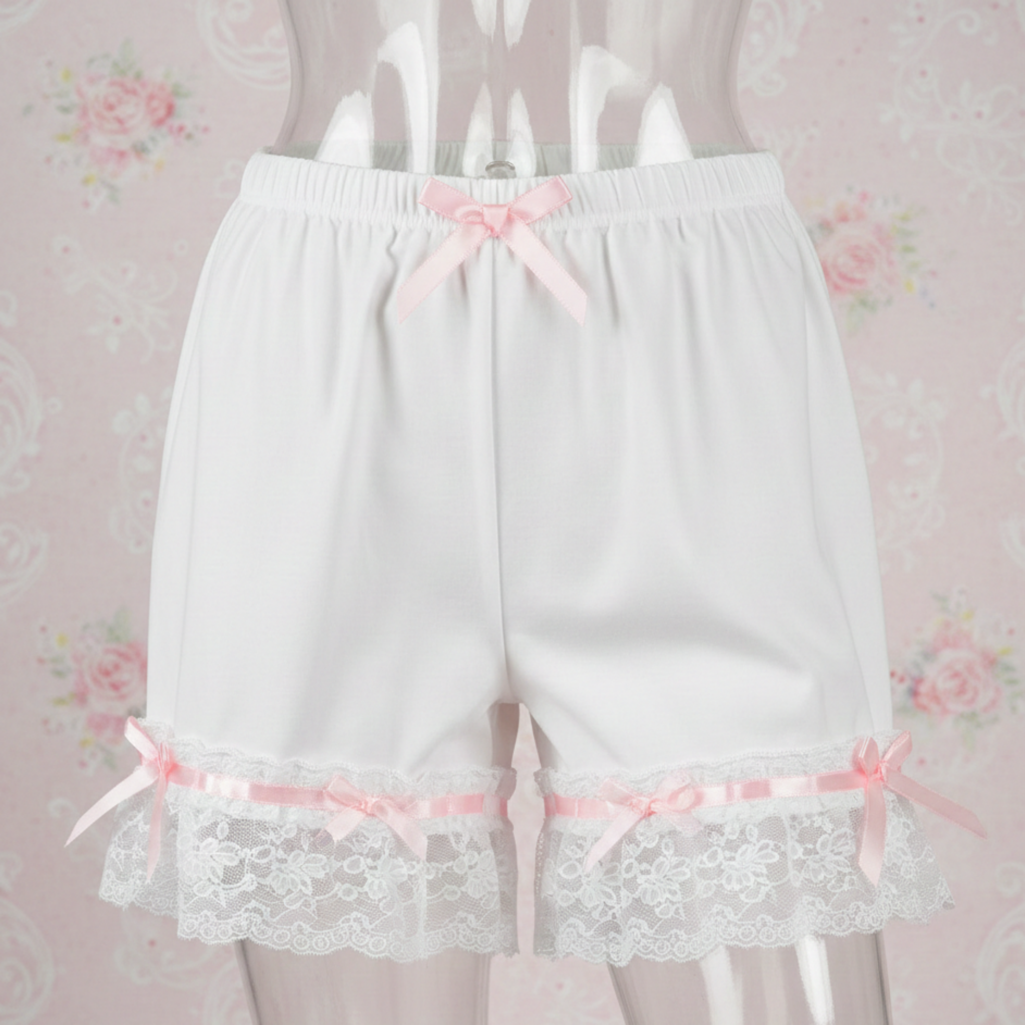 White lace Satin Sleep shorts with pink ribbons on a floral background